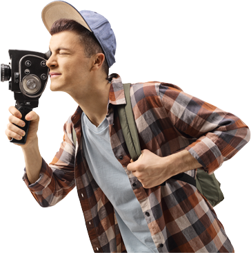 Teenager filming with a vintage video camera