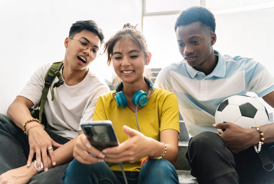 teens watching a video on smartphone